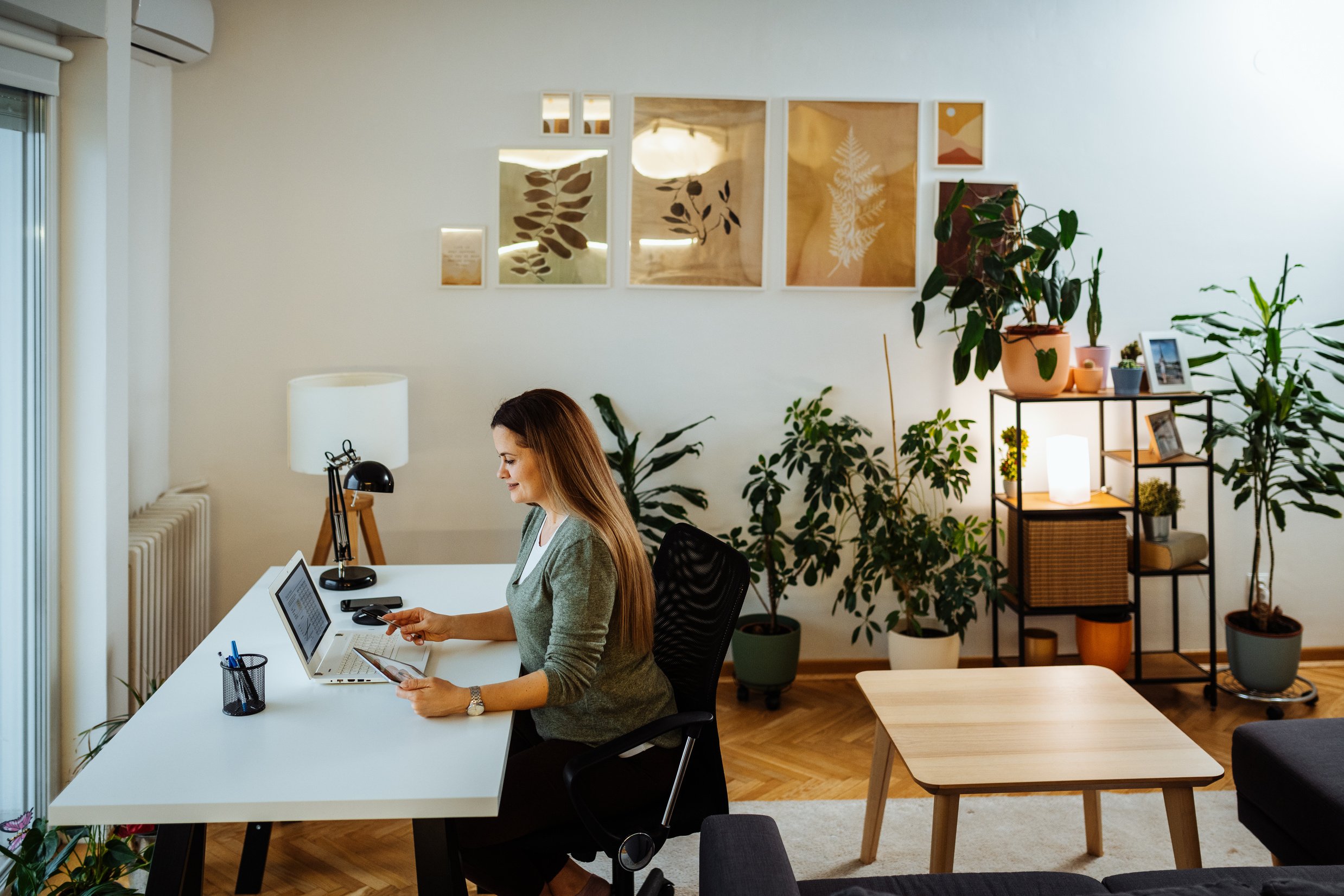 Woman working from home, hybrid workspace